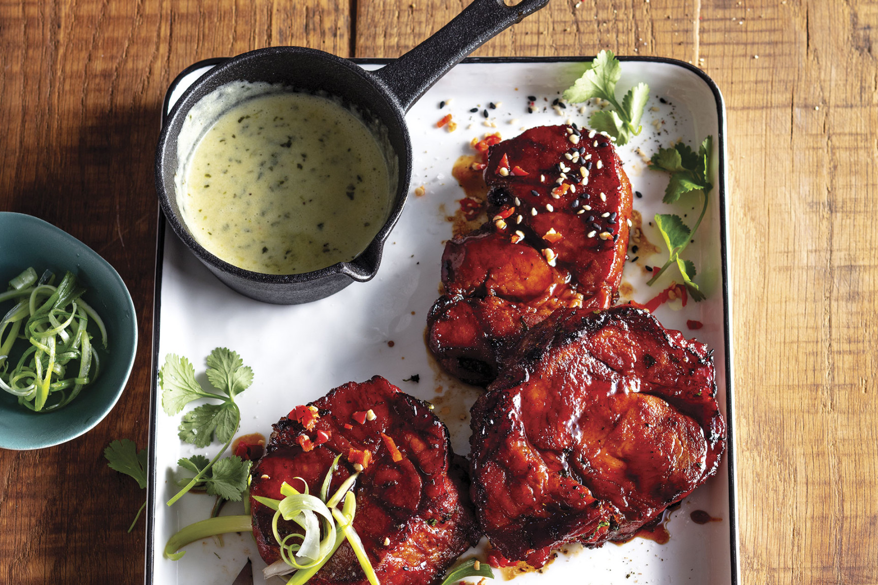 Asian-style smoked pork rib-eye steaks with creamy garlic sauce